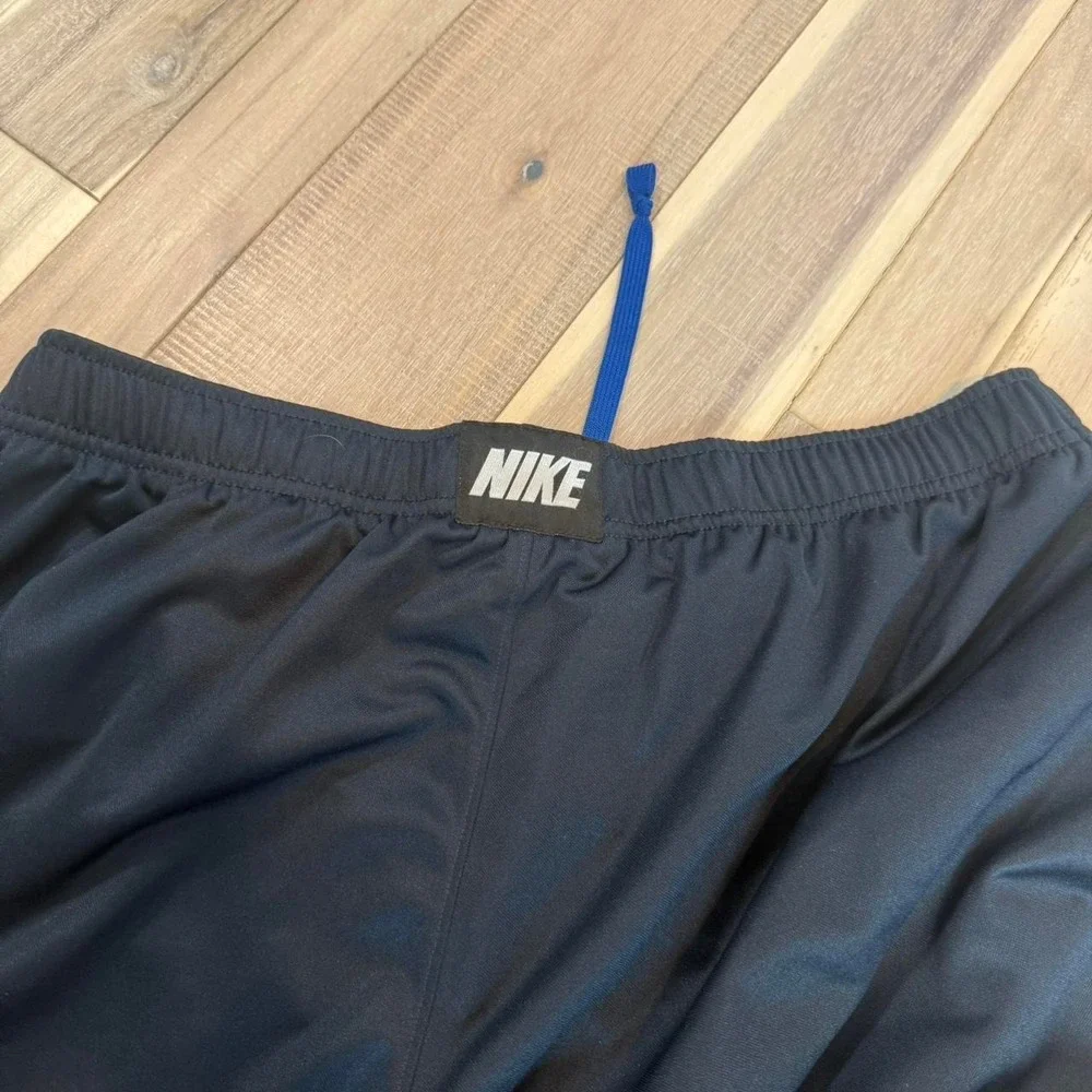 2000s baggy Nike black track pants with blue stripe sz XL